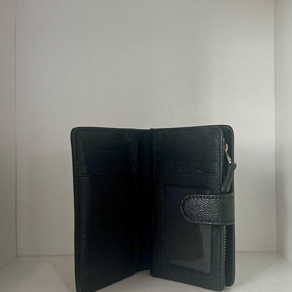 This coach wallet has been used before, but it is in decent shape. - Picture 5 of 6
